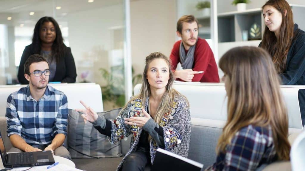 workplace employees talking about improving their communication skills