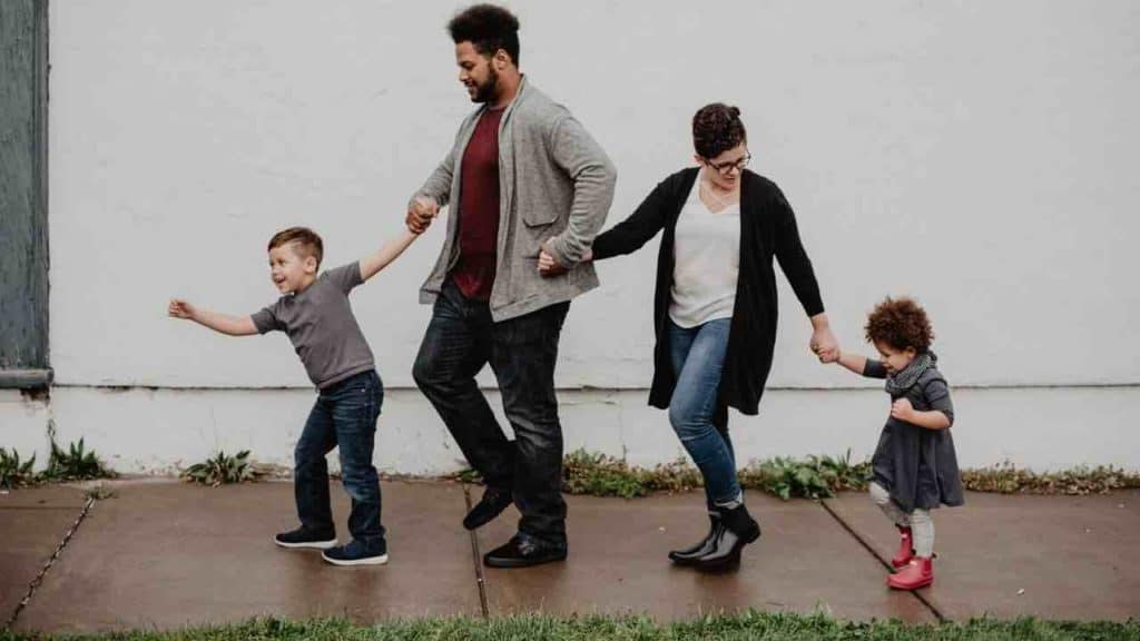family going on a walk thinking about how to buy life insurance