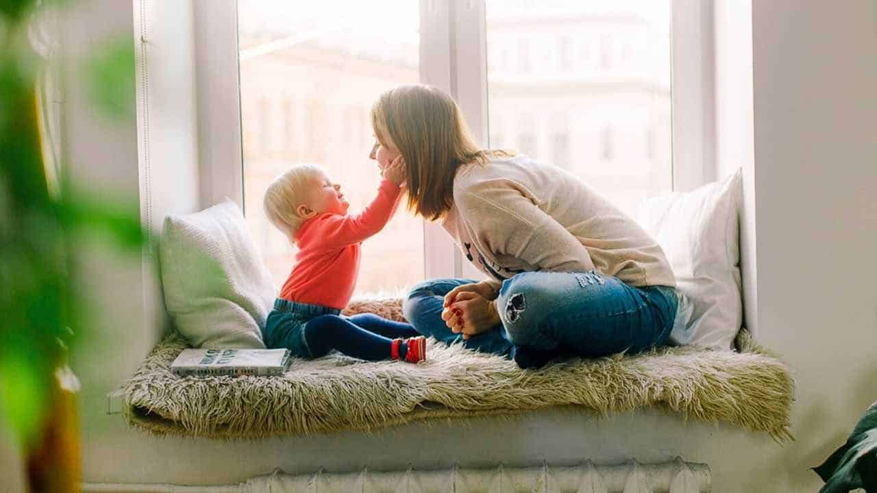 mom with child thinking about her savings